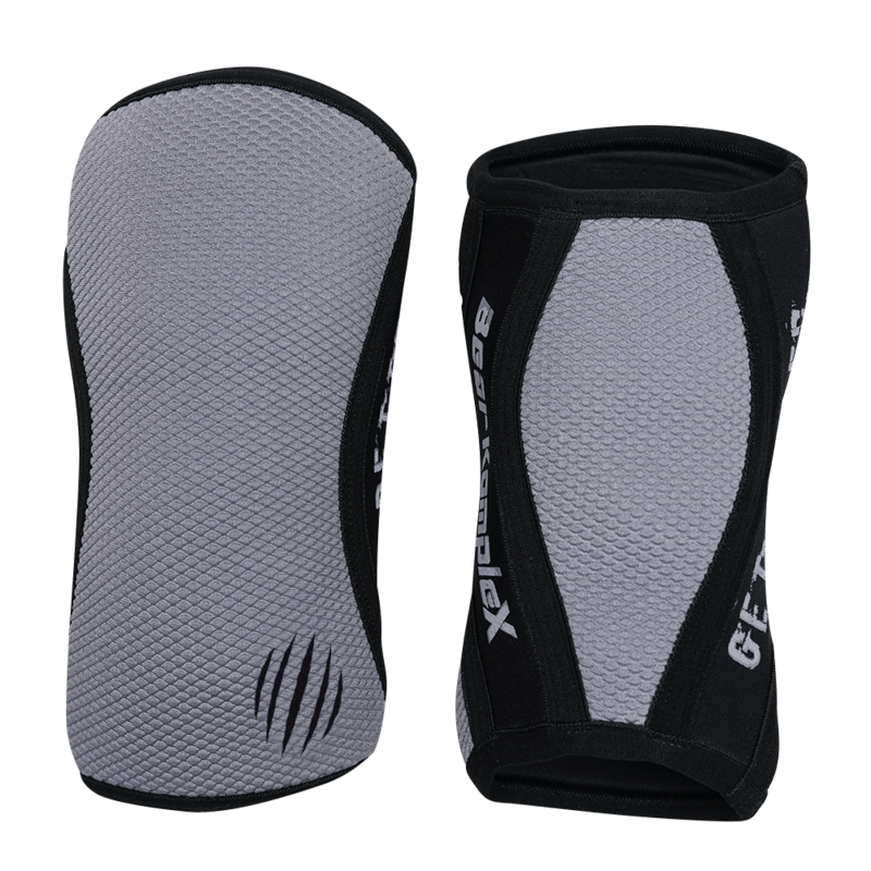 Gray Sharkskin Bear KompleX knee sleeves shown on a model, designed for support and compression during workouts.