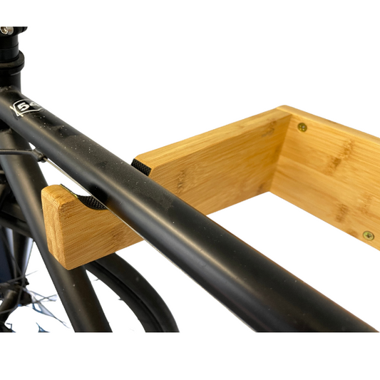 COR Surf bamboo bike mount with removable shelf, a durable accessory for attaching and organizing items on your bicycle.