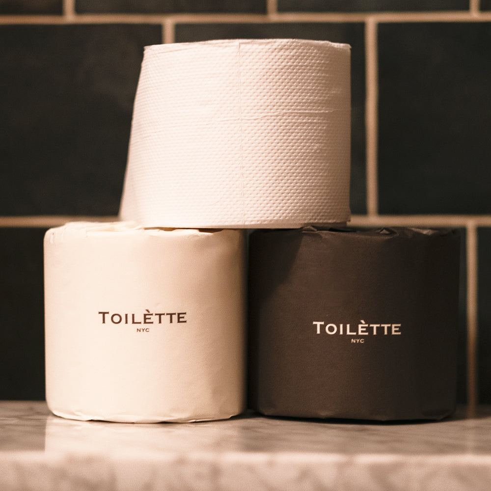 Toilette brand toilet paper rolls, soft and absorbent, shown in a pack ready for bathroom use.