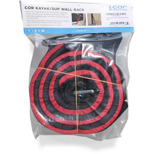 COR Surf kayak or paddleboard wall storage sling mounted on a wall, showing adjustable straps and secure hold for watercraft.