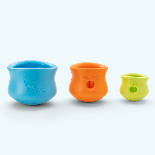West Paw Toppl toy for dogs, durable and interactive pet toy with colorful design, designed for chewing and mental stimulation.