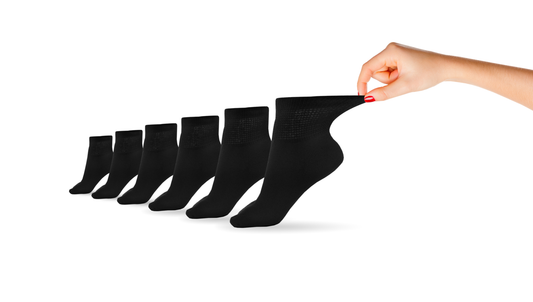 Pair of black women's ankle socks by DSC, made of cotton, designed for comfort and support for feet.