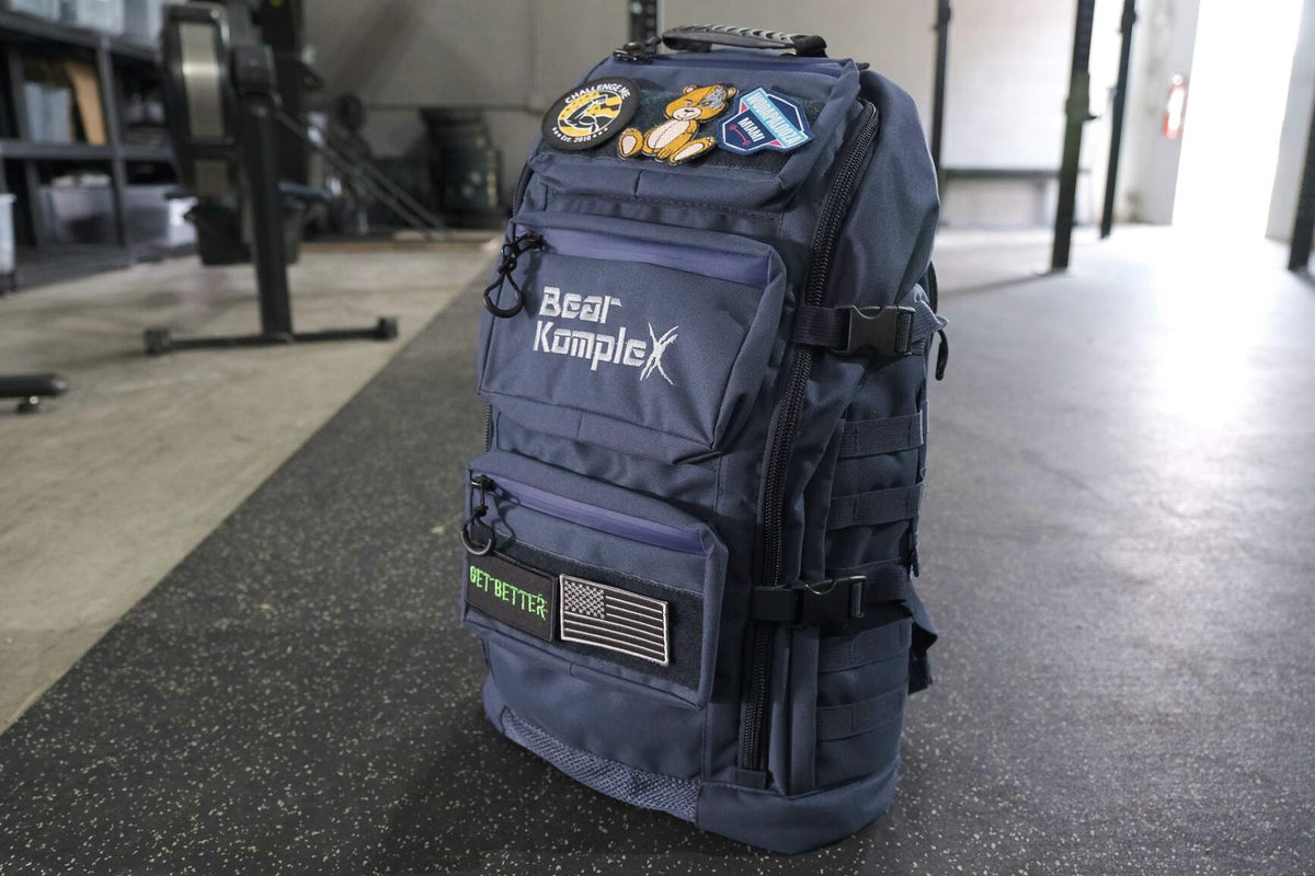 Bear KompleX BKX military backpack with multiple compartments and adjustable straps, designed for durability and outdoor use.