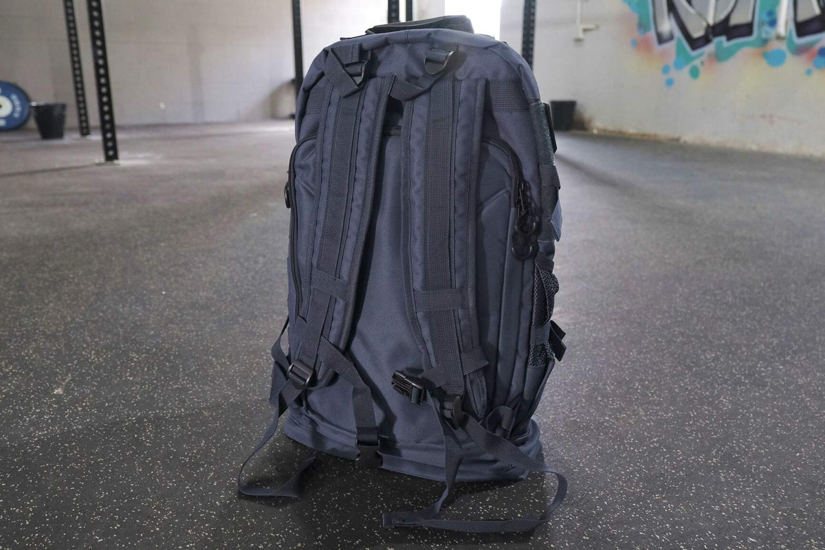 Bear KompleX BKX military backpack with multiple compartments and adjustable straps, designed for durability and outdoor use.