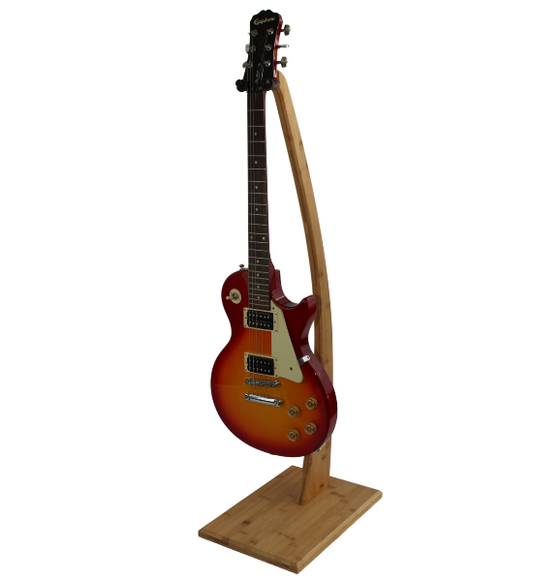 COR Surf bamboo guitar stand showing a sleek, natural bamboo design holding an acoustic guitar for easy access and stylish display.