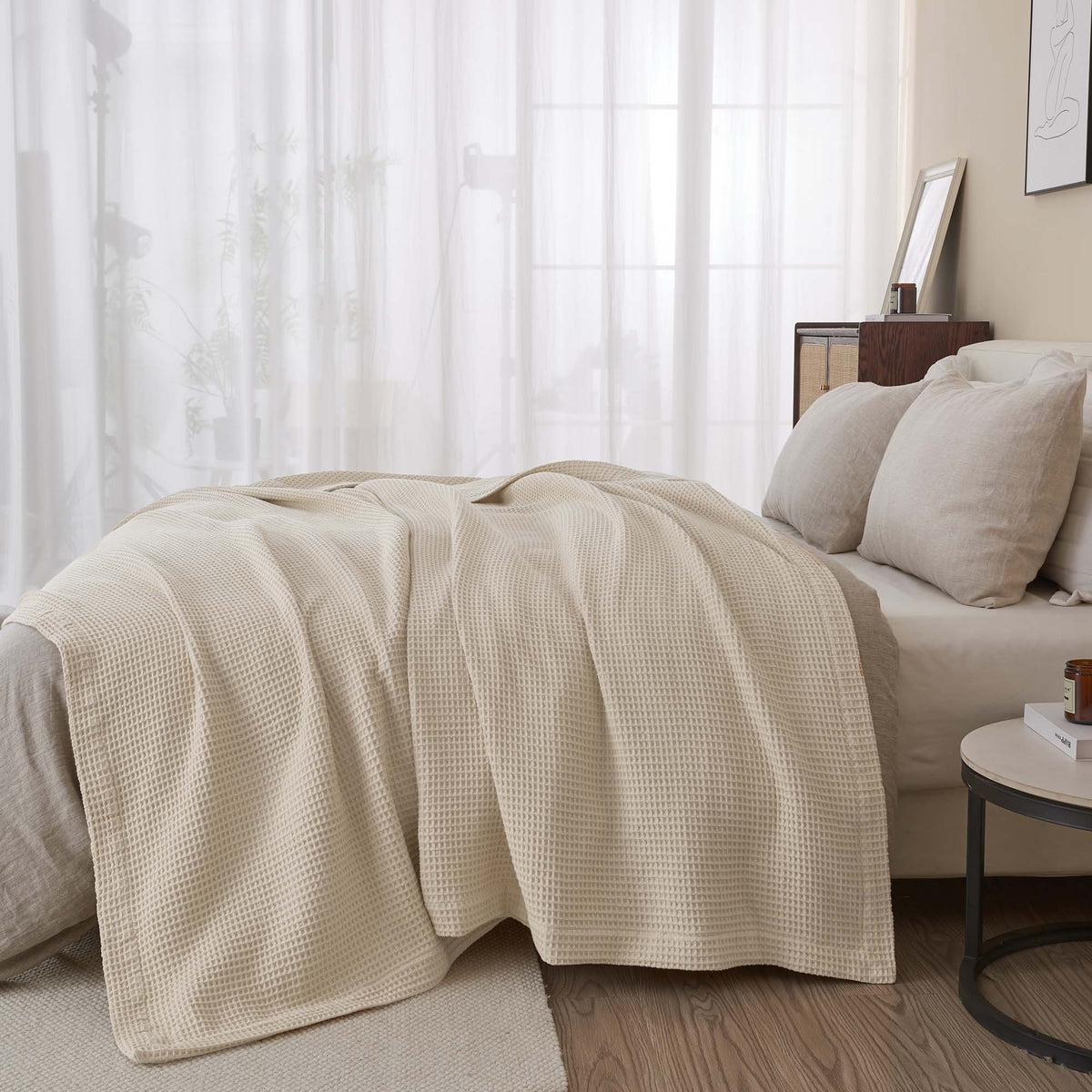 Cream-colored 100% cotton waffle weave blanket from the Mikala Collection by Great Bay Home displayed on a bed.