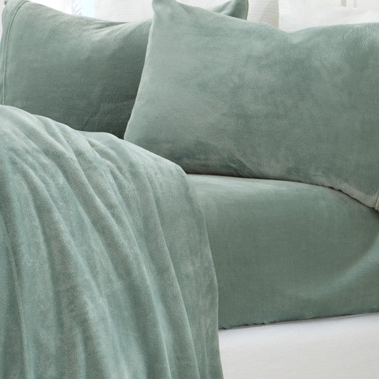 Four-piece set of velvet plush sheets from the Great Bay Home Velvet Luxe Collection, soft and luxurious bedding in solid colors.