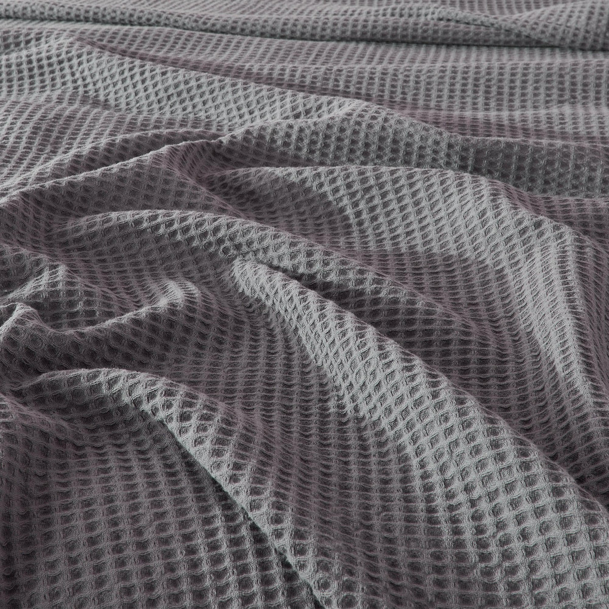 Cream-colored 100% cotton waffle weave blanket from the Mikala Collection by Great Bay Home, featuring textured pattern and soft fabric.