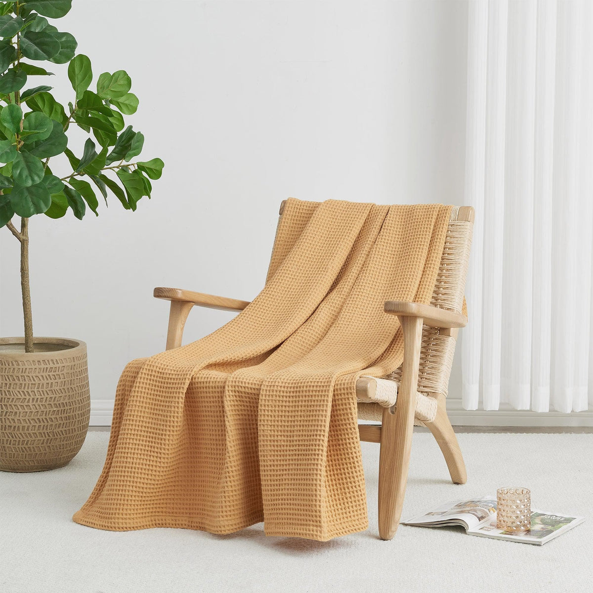 Cream-colored 100% cotton waffle weave blanket from Great Bay Home's Mikala Collection, shown draped over a bed.