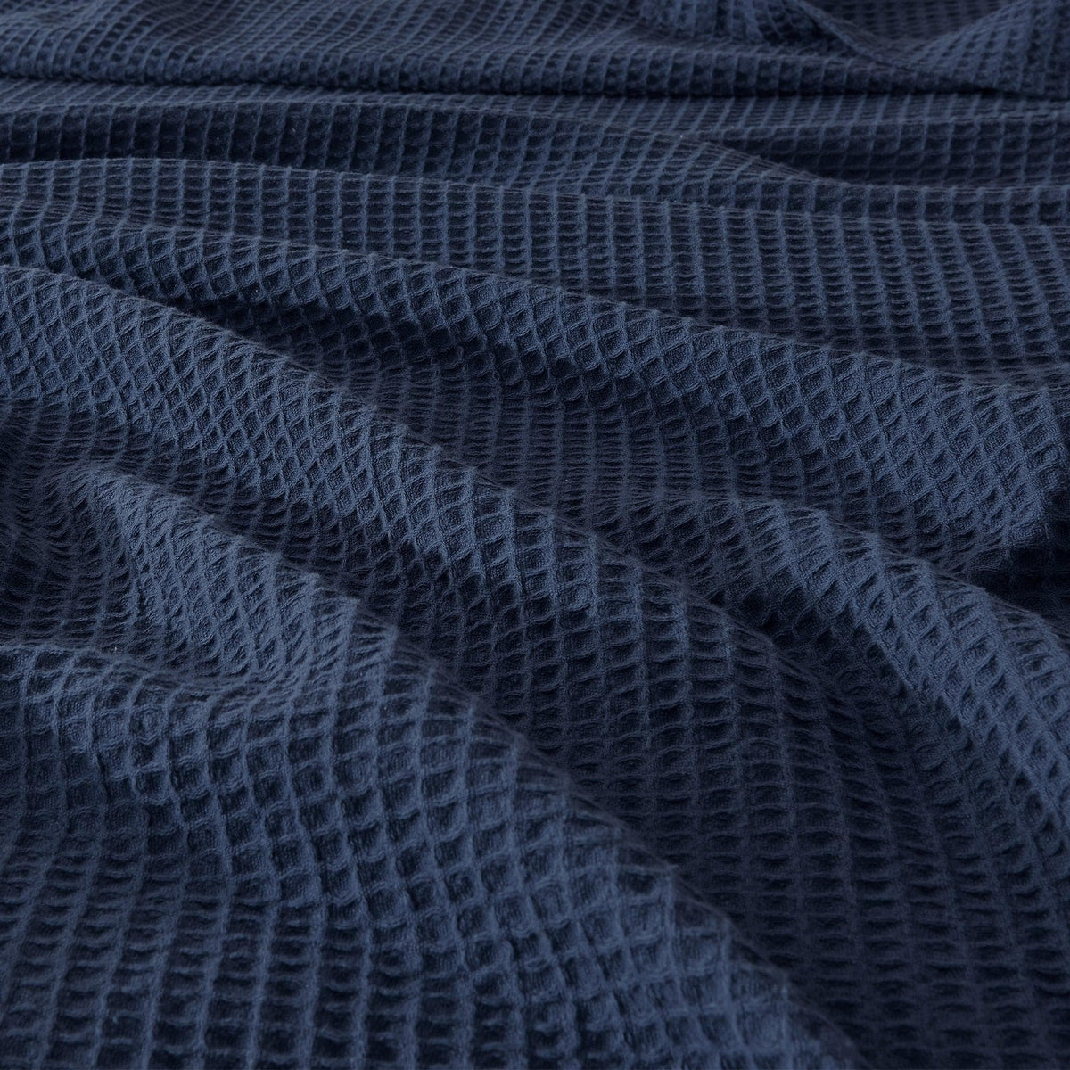 Soft 100% cotton waffle weave blanket from Great Bay Home Mikala Collection, showcasing its textured pattern and cozy design.