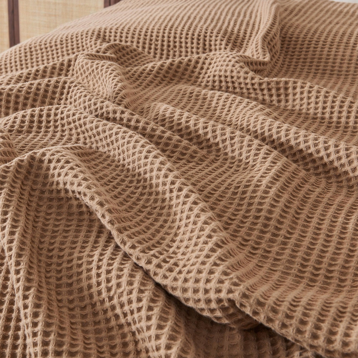 Great Bay Home 100% cotton waffle weave blanket from the Mikala Collection, showing soft, textured fabric in a cozy design.