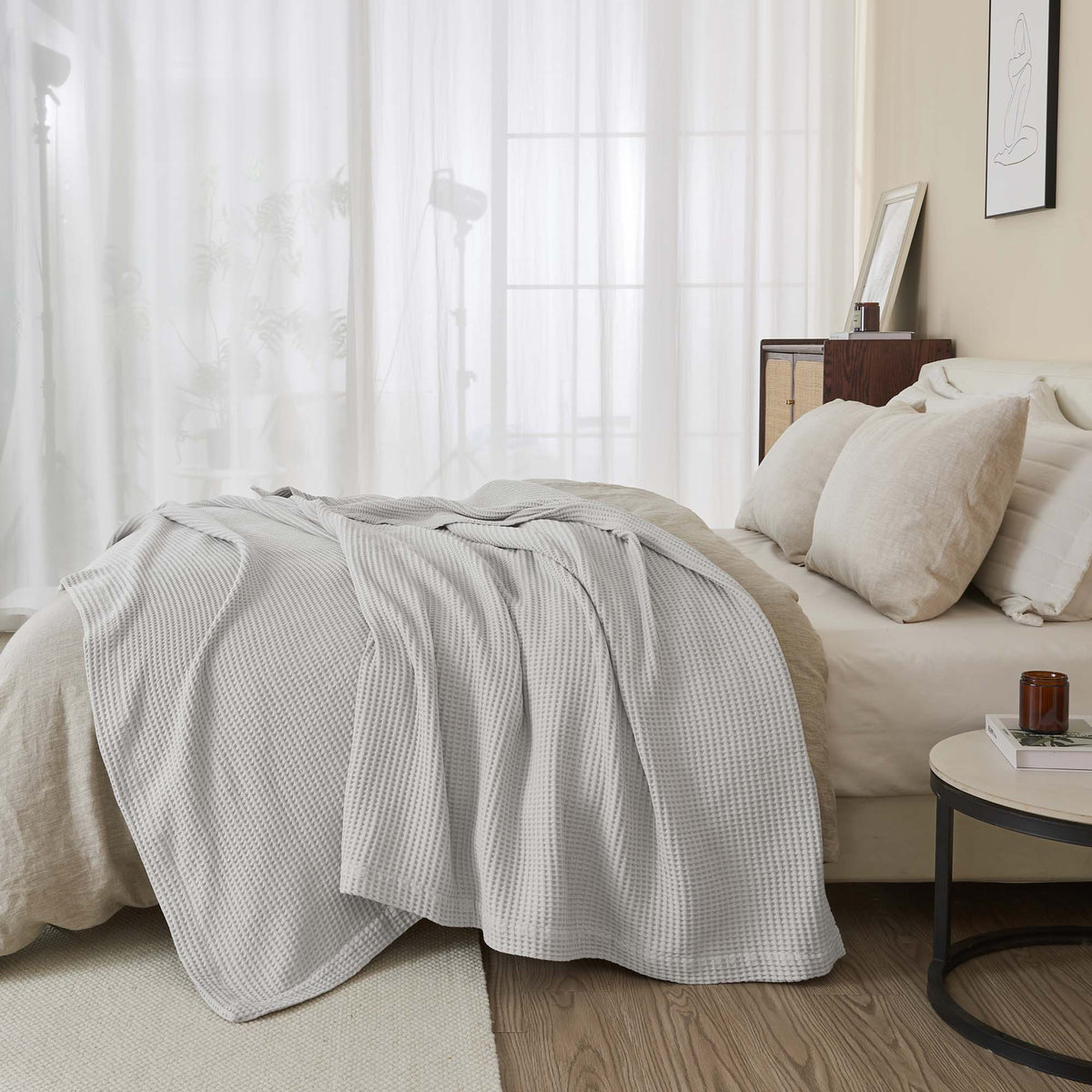 Cream-colored 100% cotton waffle weave blanket from Great Bay Home's Mikala Collection, showcasing its textured pattern and soft fabric.