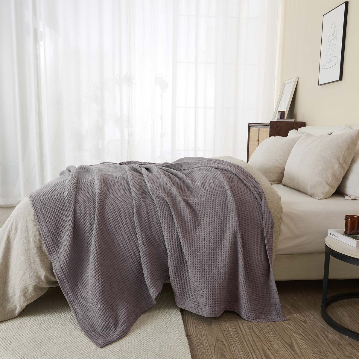 Cream-colored 100% cotton waffle weave blanket from the Mikala Collection by Great Bay Home, shown folded on a bed.