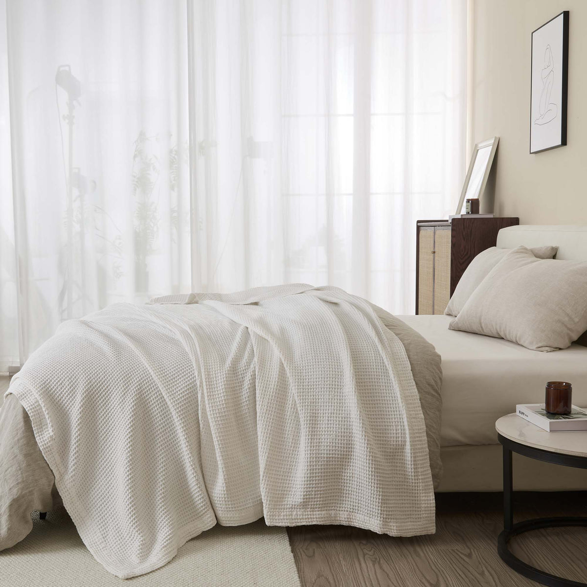 Soft white 100% cotton waffle weave blanket from Great Bay Home Mikala Collection, showcasing its textured pattern and cozy fabric.