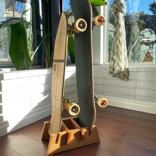 Double bamboo skateboard floor stand by COR Surf holding two skateboards for stylish display and organization.
