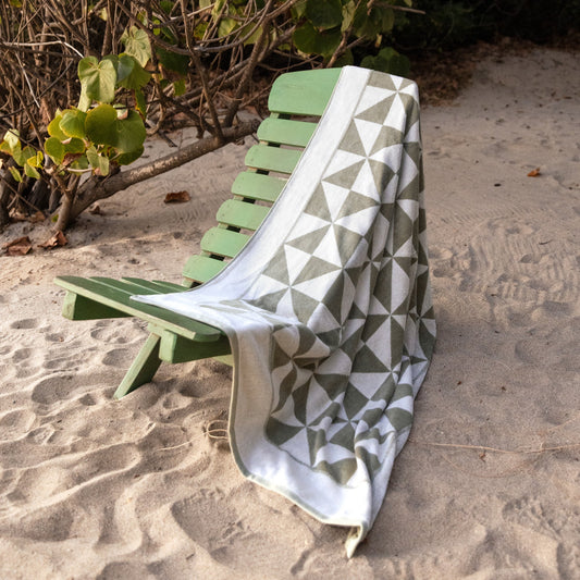 Umbra Australian cotton bath towel from Italic with soft, plush texture, shown folded on a bathroom towel rack.