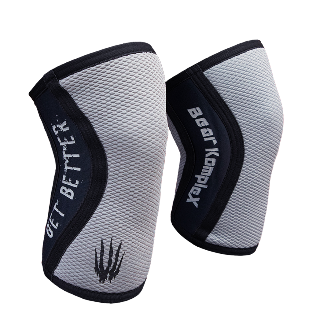 Gray Sharkskin Bear KompleX knee sleeves showing a snug fit and textured fabric design for support and compression.