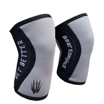 Gray Sharkskin Bear KompleX knee sleeves showing a snug fit and textured fabric design for support and compression.