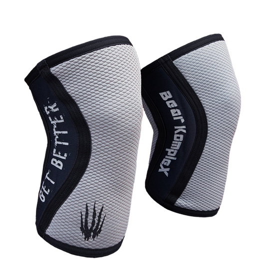 Gray Sharkskin Bear KompleX knee sleeves showing a snug fit and textured fabric design for support and compression.