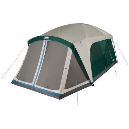 Three-season Coleman Skydome Tent set up outdoors, featuring durable fabric and mesh windows for camping and outdoor adventures.