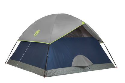 Coleman Sundome Tent set up outdoors, featuring a green waterproof camping tent with mesh windows and a rainfly for outdoor camping.
