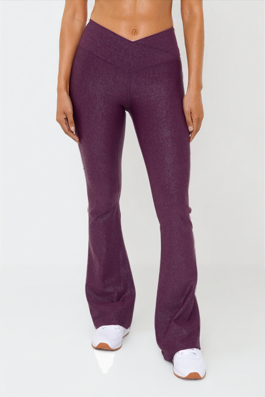 Black Luxe Edge leather-look crossover flare leggings by Fitkitty Culture, showing the high-waist design and stylish flare leg detail.