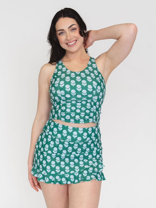 Lime Ricki Juniper Charm Scoop Racer-Back Tankini Top in blue with floral print and scoop neckline, displayed on a hanger.