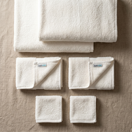 Ecobrands® luxury organic bath towel set with six plush, soft, eco-friendly towels displayed in a cozy bathroom setting.