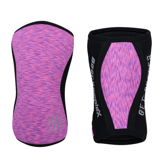 Pink Heather Bear KompleX knee sleeves shown on a pair of legs, offering support and compression for athletic workouts.