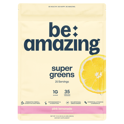 Be Amazing Pink Lemonade Super Greens powder in a container, showing the vibrant label and product packaging.