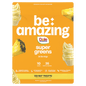 Be Amazing Super Greens powder in a container with a Dole Whip Pineapple flavor label, showcasing vibrant green supplement packaging.
