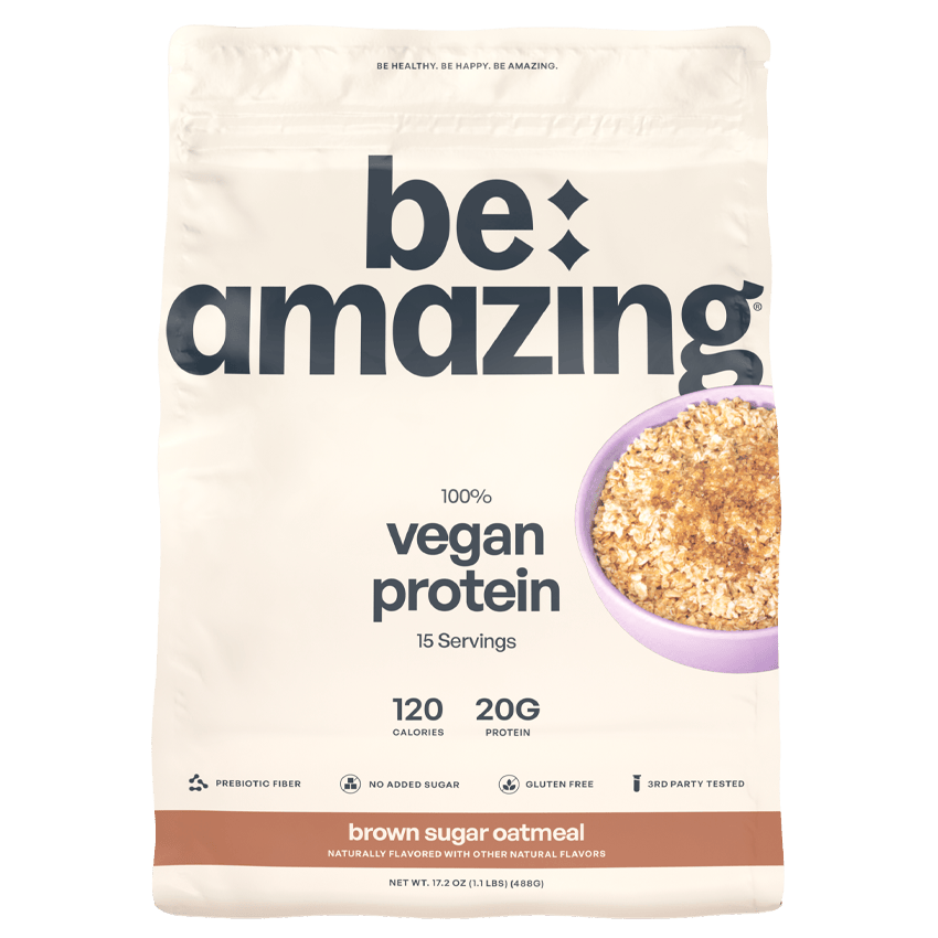 Be Amazing vegan protein powder with brown sugar and oatmeal flavor, showing the container and scoop on a neutral background.