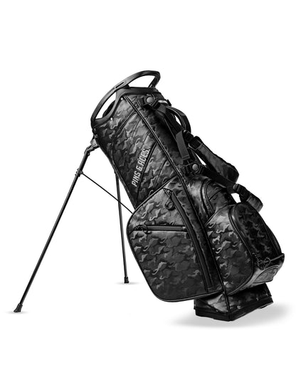 Player Preferred™ golf bag in black camo by Pins and Aces, featuring multiple compartments and padded straps for easy carrying.