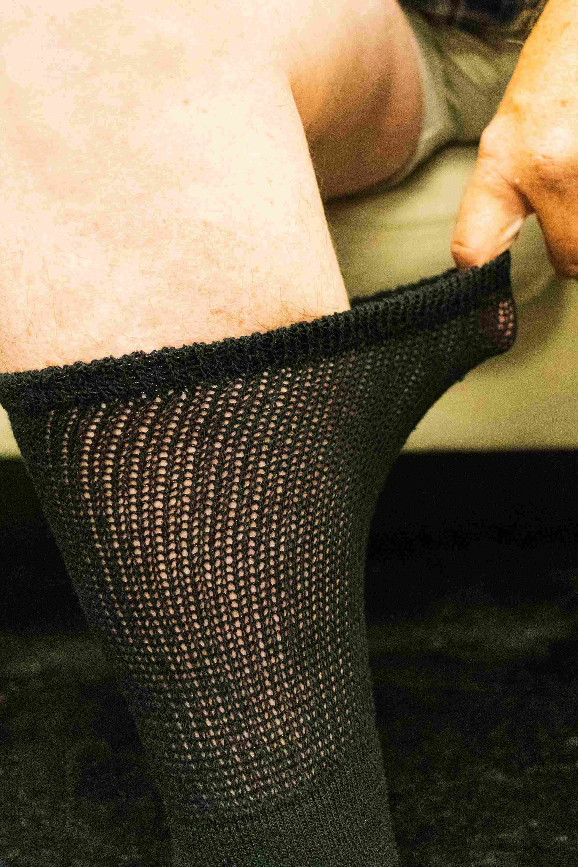 Four pairs of DSC men's ultra-soft upper calf diabetic socks with seamless knit and breathable fabric for comfort and support.