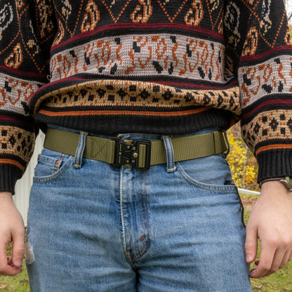 Canvas EDC belt from Americana Pipedream Apparel featuring durable canvas material and metal buckle, displayed on a neutral background.