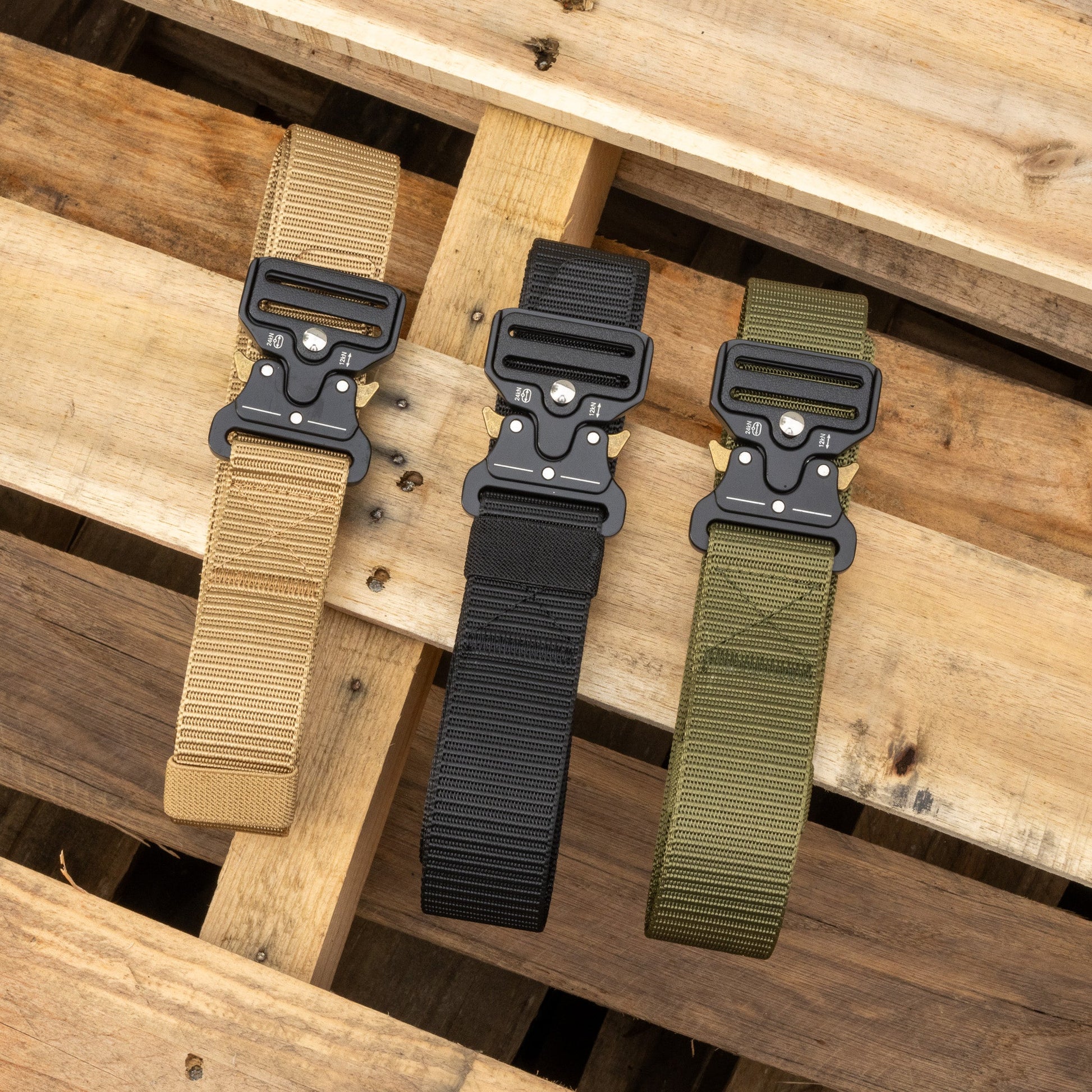 Canvas EDC belt from Americana Pipedream Apparel showing durable beige fabric with metal buckle and reinforced stitching.