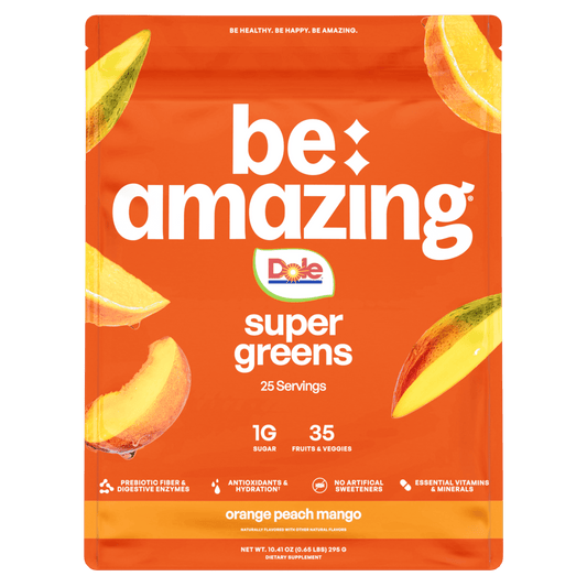 Be Amazing Super Greens juice with orange, peach, and mango in a clear glass bottle, showcasing vibrant fruit flavors.