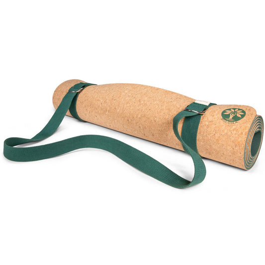 Green Yoloha Yoga sling and strap for carrying yoga mats, made of durable material, designed for easy transport and storage.