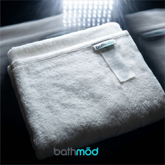 Set of four luxury organic bath mats by ecobrands® featuring soft, absorbent fabric and modern design for comfortable bathroom decor.