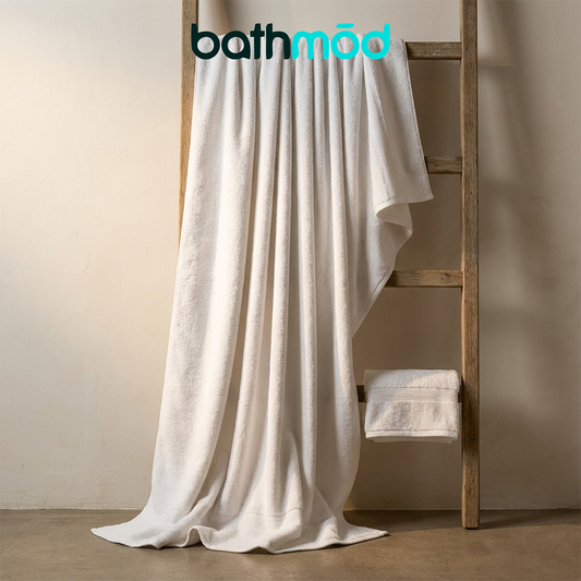 Eco-friendly ecobrands® luxury organic bath towels in a two-pack, soft, GOTS certified bath sheets laid out on a bathroom surface.