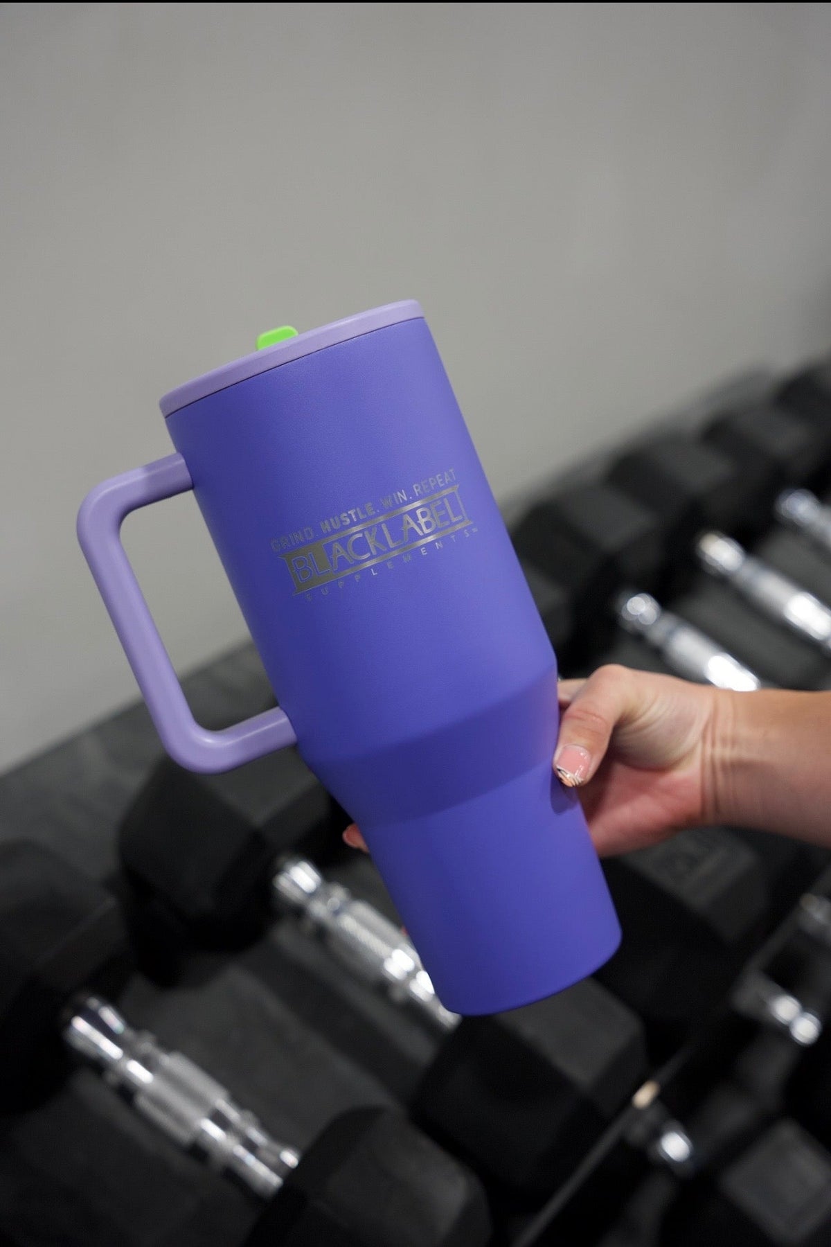 BlackLabel Supplements HydroJug 40 oz. traveler water bottle with handle, durable plastic and leak-proof lid for on-the-go hydration.