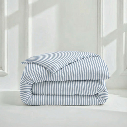 Cream-colored Luxe Australian Sateen Duvet Cover by Italic, showcasing smooth fabric and elegant stitching on a neatly made bed.