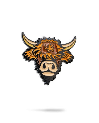 Highland cow-shaped ball marker accessory by Pins and Aces, featuring detailed design for golf or outdoor use.