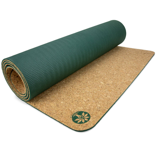 Yoloha Yoga original cork yoga mat laid flat, showing its natural cork surface and textured grip for yoga and Pilates practice.