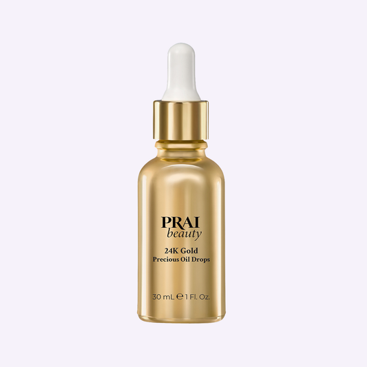 PRAI Beauty 24K Gold Precious Oil Drops in a 30ml bottle, featuring luxurious gold-infused skincare for radiant skin.