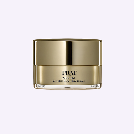 PRAI Beauty 24K Gold Wrinkle Repair Eye Cream in a 15ml jar showing the luxurious gold packaging and smooth cream texture.