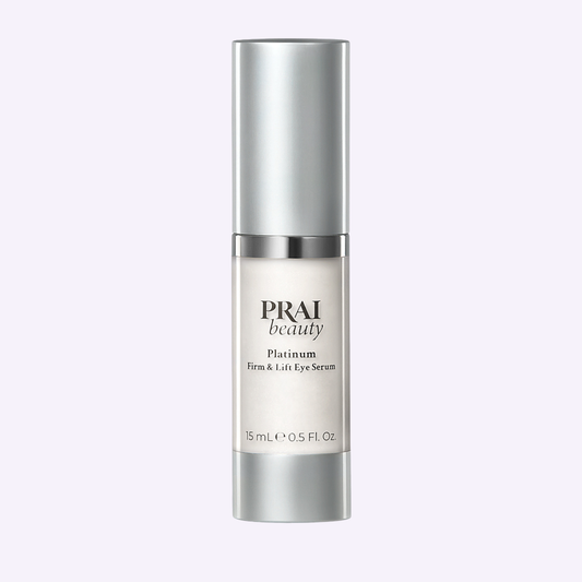 PRAI Beauty Platinum Firm & Lift Eye Serum in 15ml bottle, featuring a sleek design and applicator for eye area skincare.
