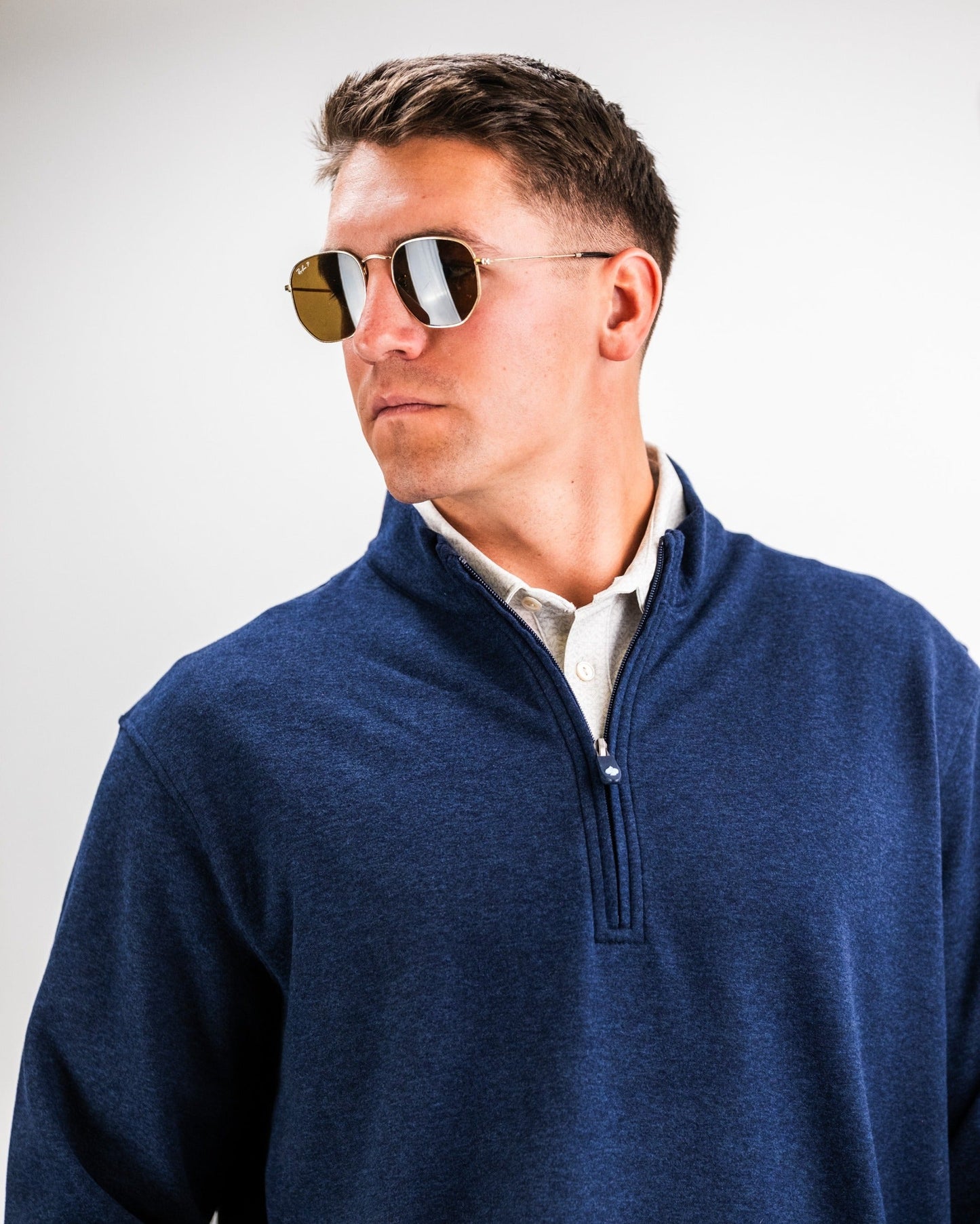 Men's Heathered Navy Player Preferred™ Pullover by Pins and Aces, navy-colored men's outerwear with a comfortable fit and subtle branding.
