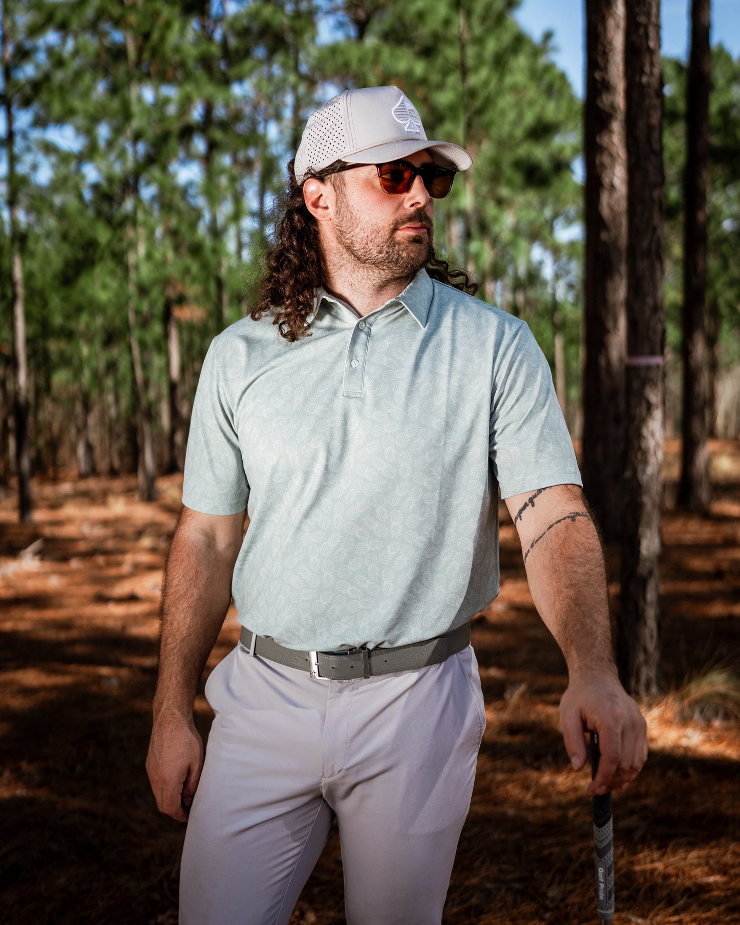 Men's pineapple print polo shirt by Pins and Aces featuring a vibrant pineapple pattern on a casual polo fabric.