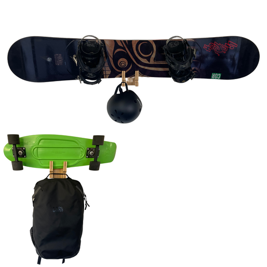 COR Surf bamboo skateboard and snowboard wall rack mounted on a wall, designed for easy storage and display of boards.